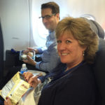 Associate Creative Director, Charlie Worcester, enjoys his first class seat alongside Alaska Air Cargo’s Shannon Stevens.