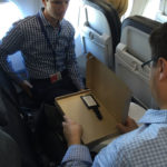 Charlie Worcester holds an impromptu creative presentation for Alaska Air Cargo’s Marketing Manager, Rick Bendix.